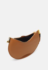 Brown leather pouch bag with a curved shape, gold-toned zipper hardware, and smooth texture; interior is black.