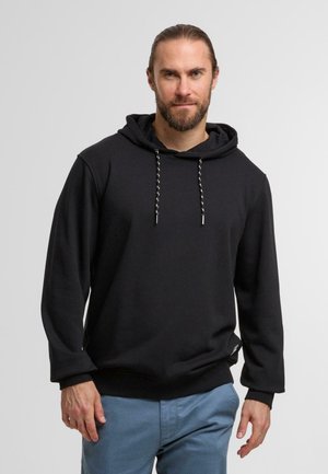 Zwarte hoodie van zacht materiaal met een kangoeroezak. Voorzien van een capuchon met trekkoorden in contrastkleur en ribgebreide manchetten.