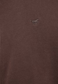 Brown knitted sweater with a smooth texture. Features a subtle embroidered horse logo on the front in a matching color.