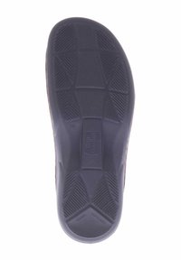 Shoe insole with a textured surface, black rubber material, and a contoured shape featuring non-slip grip patterns and manufacturer's logo.