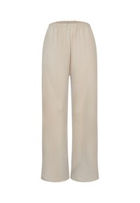 Pantalon ample beige à jambes larges avec une ceinture élastique et un tissu lisse légèrement texturé sur un fond uni.