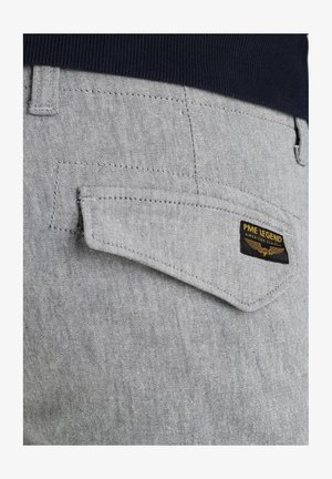 Gray denim fabric with a textured surface. The angled back pocket features a black label with "PME LEGEND" text and wing graphic.