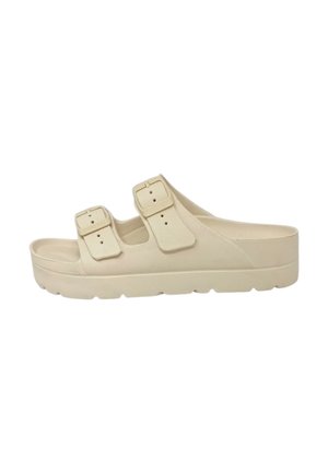 Sandalo beige slip-on con due cinturini regolabili con fibbia e suola spessa, progettato per un uso casual.