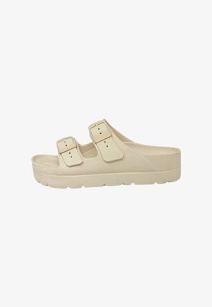 Sandalo beige slip-on con due cinturini regolabili con fibbia e suola spessa, progettato per un uso casual.