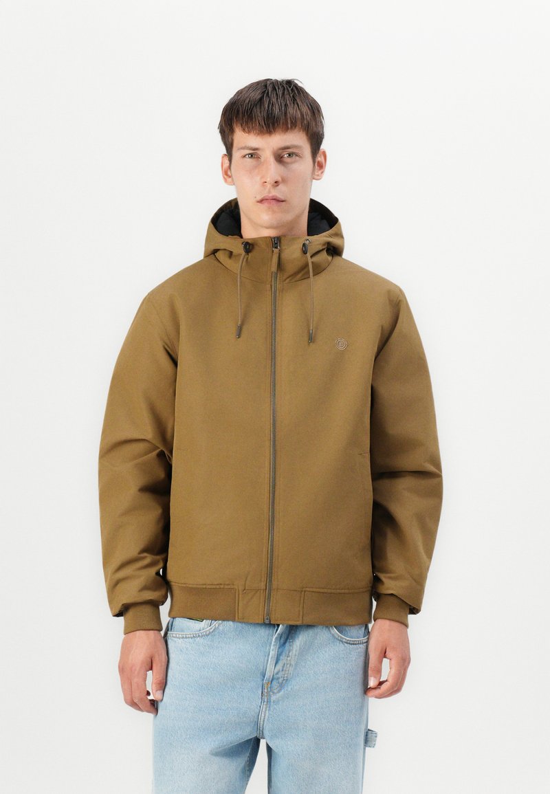 Bruine hoodie met een voorkant rits, elastische manchetten en een trekkoord. Bevat een eenvoudig logo en een gladde, matte afwerking.