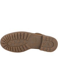 Suela de zapato de goma marrón con texturas, que presenta patrones circulares y cruzados para mayor tracción. Bordes reforzados y diseño plano.
