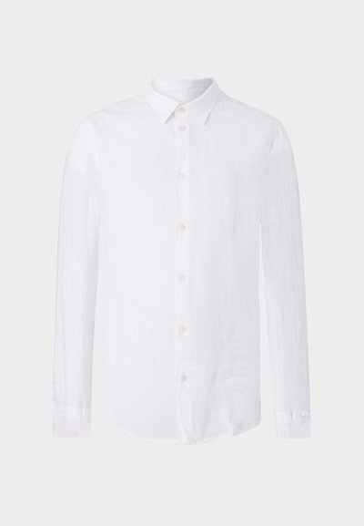White long-sleeve shirt made of linen. Features a classic collar, button front, and curved bottom hem with a textured, lightweight finish.