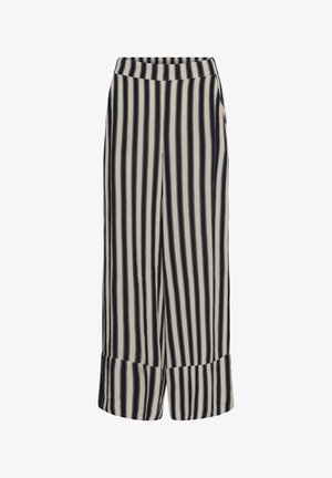 Wijde broek met verticale zwart-witte strepen en brede zomen aan de onderkant, ontworpen voor een ontspannen pasvorm.