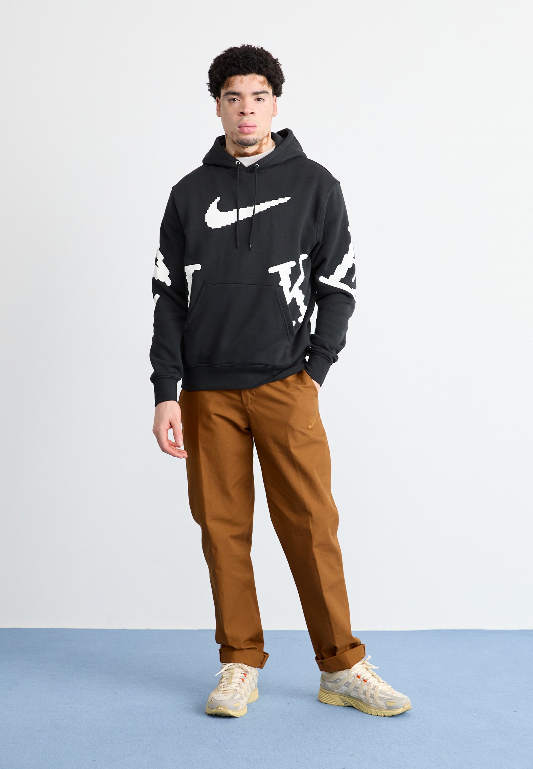 orange black and white nike hoodie