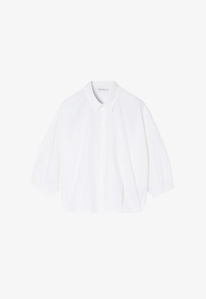 Bijela pamučna bluzica s klasičnom kragnom, polu-ruhovima i kopčanjem sprijeda. Glatkasta tekstura, širok kroj i skraćeni dizajn.