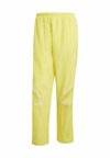 ADICOLOR 2000S WOVEN TRACK LOOSE - Treniņtērpa apakšdaļas - pure sulfur   powder yellow