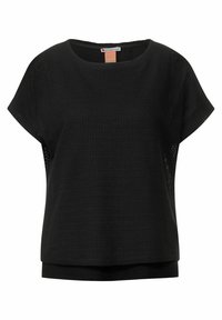 Svart kortärmad topp med ett texturerat, andningsbart tyg. Rundad halsringning, lös passform och en lagerdesign vid nederkanten.