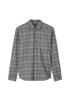 Chemise à carreaux noire et blanche à boutonnage, avec des manches longues, un col et une poche poitrine. Le tissu semble texturé et légèrement brossé.