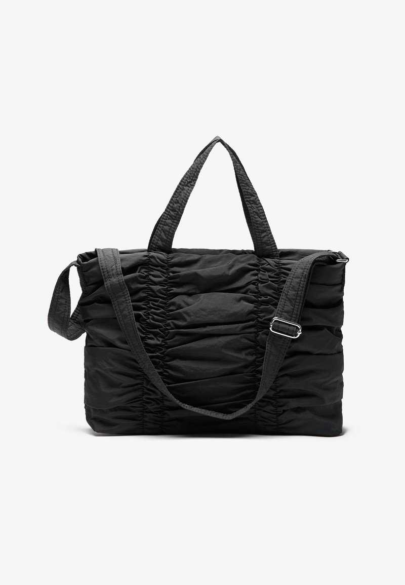Black tote bag featuring a ruched design, dual handles, and an adjustable strap. Made from textured fabric with a smooth finish.