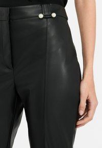 LIU JO FLARED - Pantaloni - black