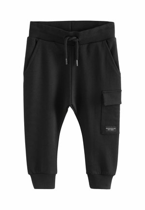 Schwarze Sweatpants aus weichem Stoff. Mit einem elastischen Bund, Kordelzug, seitlichen Taschen und einer Cargo-Tasche mit Logo-Patch.