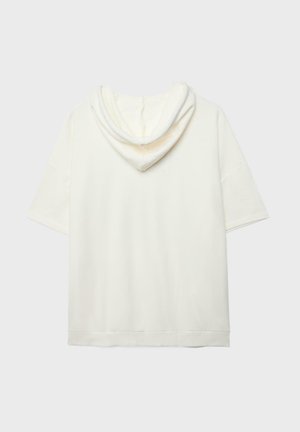 Felpa con cappuccio a maniche corte color avorio, realizzata in tessuto morbido, vista da dietro su uno sfondo chiaro e uniforme.