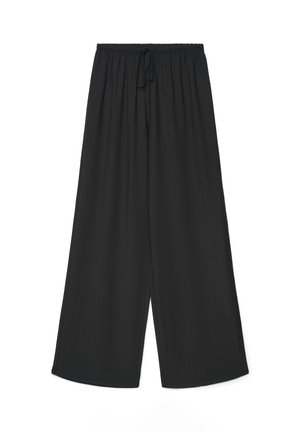Loose black wide-leg pants with elastic waistband and front tie detail, displayed against a white background.