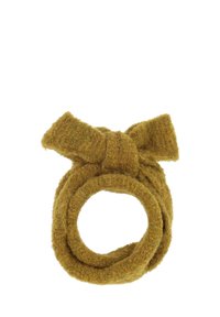 Ensemble texturé jaune moutarde en forme circulaire avec un détail en nœud sur le dessus, fabriqué en matériau doux et pelucheux.