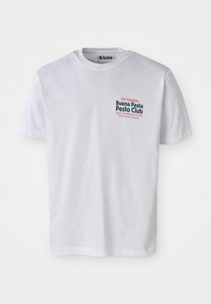 White cotton t-shirt featuring a multicolored graphic design with text that reads "On Vacation Buena Pasta Pesto Club" on the front.