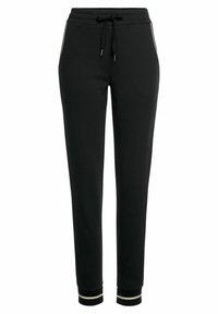 Schwarze Jogginghosen aus weichem Material, mit einem verstellbaren Kordelzugbund, Seitentaschen mit kontrastierendem Piping und gerippten Bündchen.