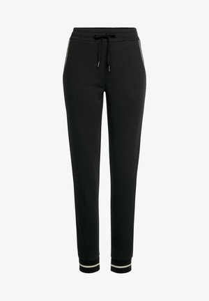 Black jogger pants made of soft fabric, featuring a drawstring waist, side pockets with contrasting piping, and ribbed cuffs.