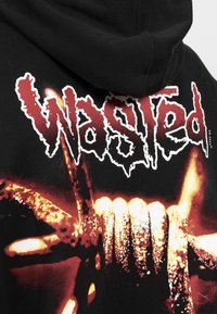 Black hoodie featuring a large graphic print of the word "Wasted" in white and red, with an illustration of hands and a fiery background.