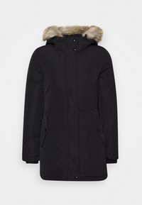 Svart isolerad vinterparkas med framfickor, hel dragkedja och knappstängning samt huva fodrad med ljusbrun fuskpäls.
