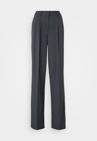 Pantalons larges gris foncé en tissu texturé. Dotés de plis à l'avant, d'une taille plate et d'un design épuré sans embellissements.