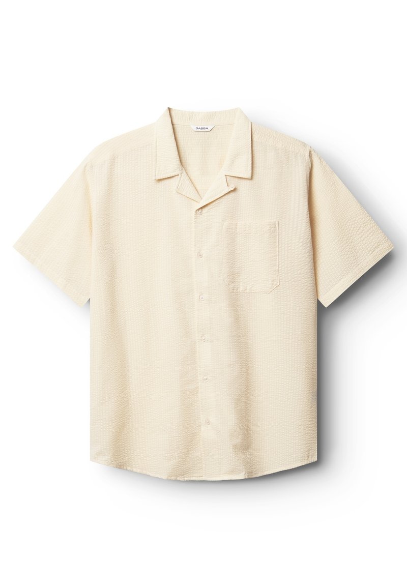 Chemise boutonnée à manches courtes, jaune pâle, avec un motif texturé, un col et une poche poitrine unique. Tissu doux et coupe décontractée.