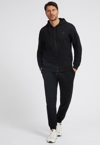 Guess Felpa con zip - schwarz