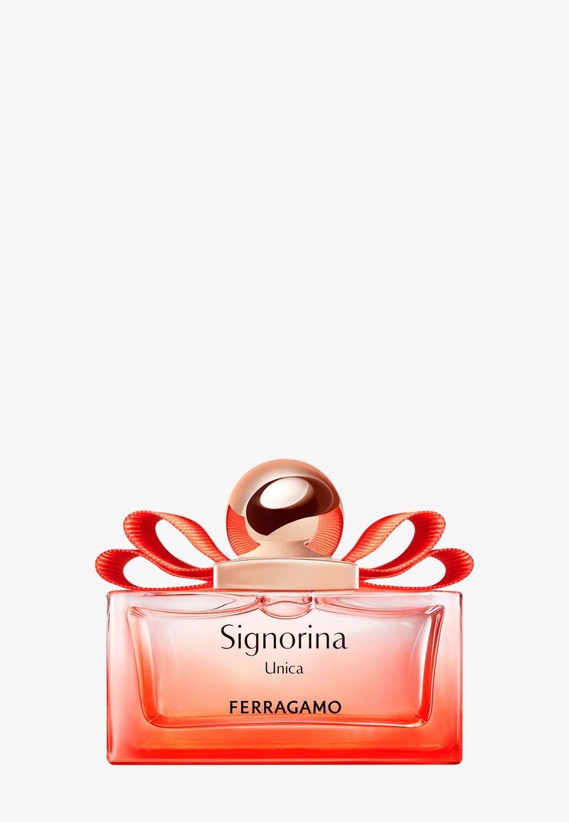 Parfümflasche mit der Aufschrift "Signorina Unica Ferragamo" mit einem runden roségoldenen Deckel und dekorativen roten Schleifenbändern.