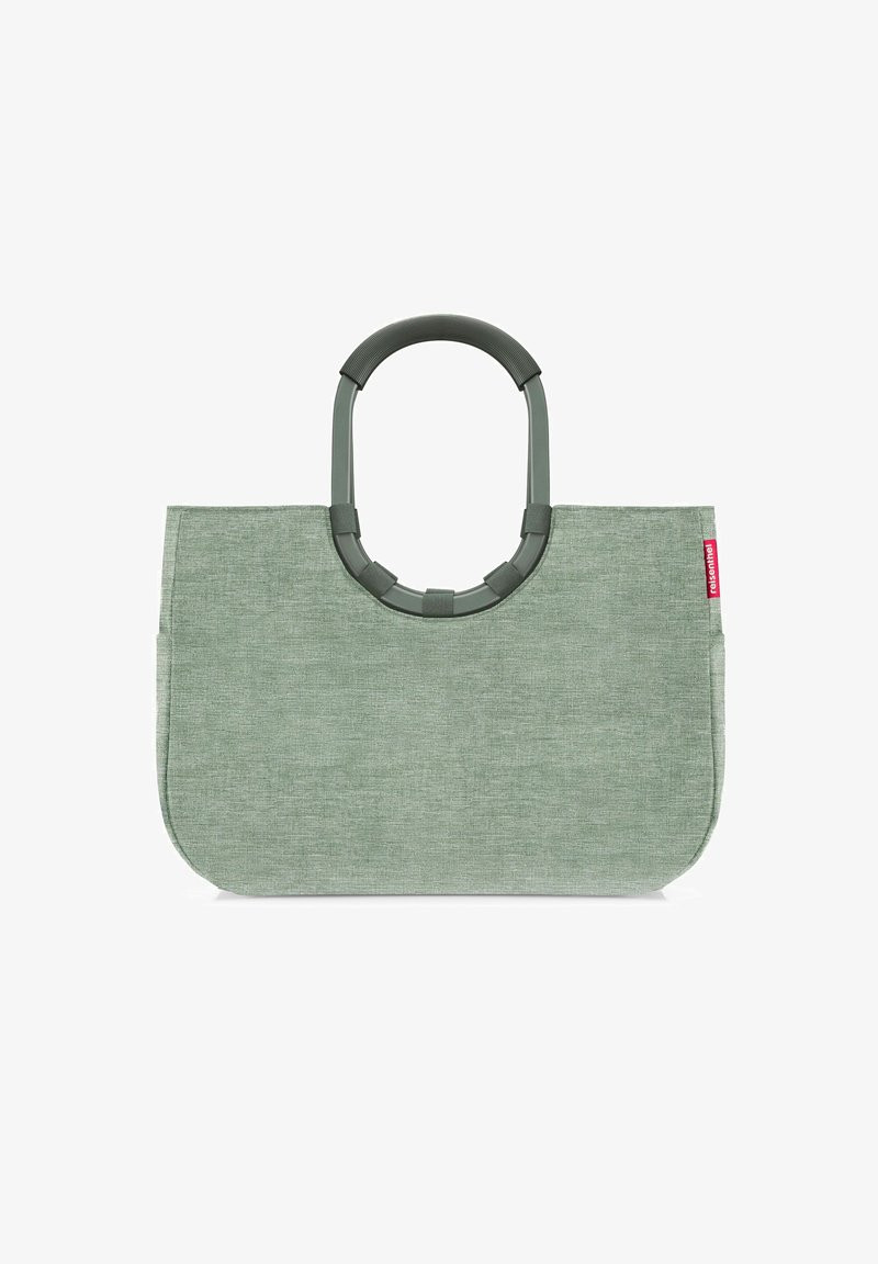 Green textile tote bag with a rounded plastic handle. The surface features a subtle weave pattern, and a small branded tag is visible.