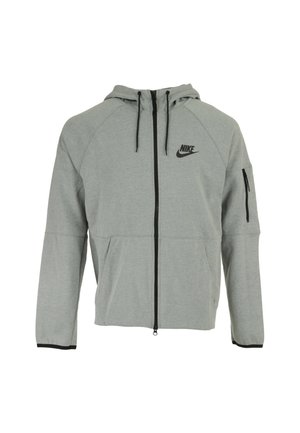 Lichtgrijze Nike hoodie met ritssluiting, frontzakken, zwarte ritssluiting en koordjes, en een ritssluiting zak op de linkermouw.