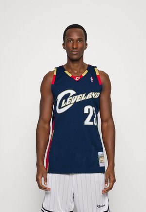 Navy basketball jersey with gold and red accents, featuring "CLEVELAND" and number "23" on the front. Complete with mesh fabric and patch detail.