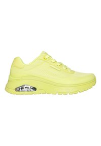 Limettengrüne Sneaker mit einem strukturierten Mesh-Obermaterial, gepolsterter Sohle mit einer transparenten Luftkammer und kreisförmigem Profil auf der Außensohle.