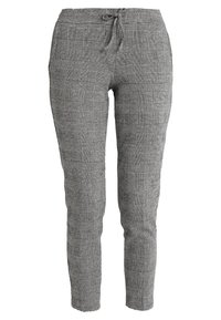 Pantalons à carreaux noir et blanc avec une coupe fuselée, taille à cordon, et poches latérales. Tissu léger avec une texture lisse.