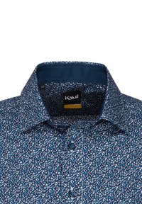Camicia a maniche corte in tessuto blu navy con un piccolo motivo floreale bianco. Caratterizzata da colletto a bottoni e bottoni blu.