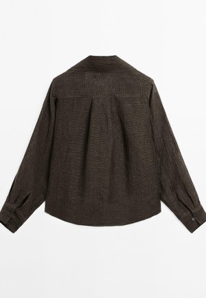 Dark brown long-sleeve shirt with a textured fabric, pleats at the back, and buttoned cuffs. Features a pointed collar and relaxed fit.
