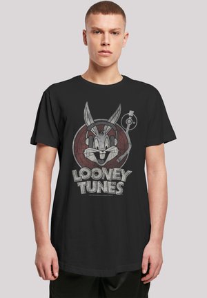 Black cotton t-shirt featuring a graphic of Bugs Bunny with headphones against a circular Looney Tunes logo. Short sleeves, loose fit.