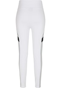 Leggings de sport blancs avec des panneaux latéraux noirs et gris, taille haute, texture lisse et coupe slim.