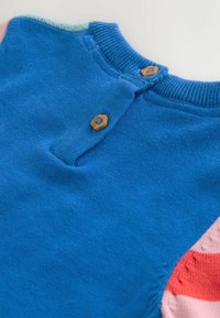 Blue knitted garment featuring a round neckline and wooden buttons. Accented with light blue, pink, and coral sections on the sleeves.