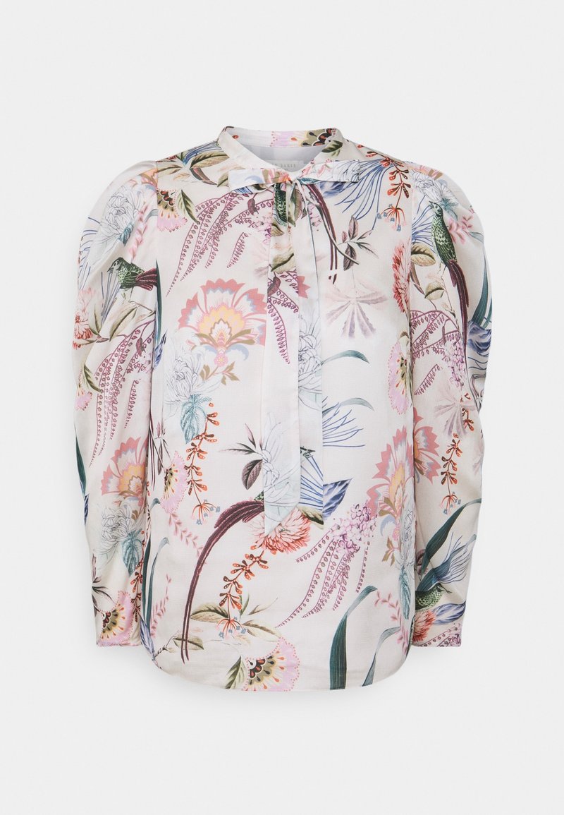 Blouse blanche à manches longues avec épaules bouffantes, ornée d'un imprimé floral multicolore et colibri, avec un lien au col.