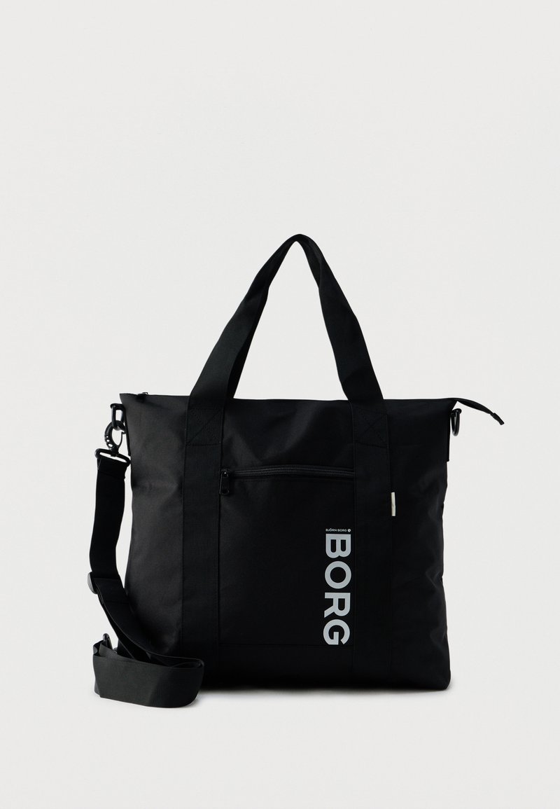 Μαύρη ορθογώνια τσάντα χειρός με διπλές λαβές, ρυθμιζόμενο ιμάντα ώμου, μπροστινή τσέπη με φερμουάρ και κάθετο λογότυπο "BORG" σε απλό φόντο.