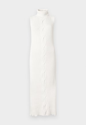 Bela, be rankovių megzta suknelė su aukštu kaklu, viduryje su pintu raštu ir banguotu kraštu, pagaminta iš riboto faktūrinio audinio.