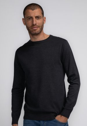 Dark gray pullover sweater with a round neckline and long sleeves, featuring ribbed cuffs and hem, made from a soft, knit fabric.