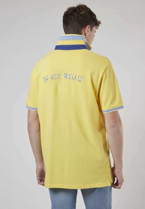 MANCHES COURTES RESORT ISLAND SUNNY - Polo - jaune