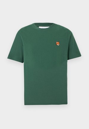 Green short-sleeve crew neck t-shirt with a small orange fox head patch on the left chest.