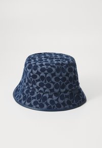 Navy bucket hat made of patterned fabric with an interlocking design, featuring a wide brim and a smooth texture.
