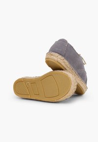 Grey espadrille shoes with a soft fabric upper, jute-wrapped soles, and a rubber base. Features a lace-up design and light stitching accents.